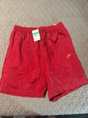 Nike Red Men's Athletic Shorts with Orange Logo